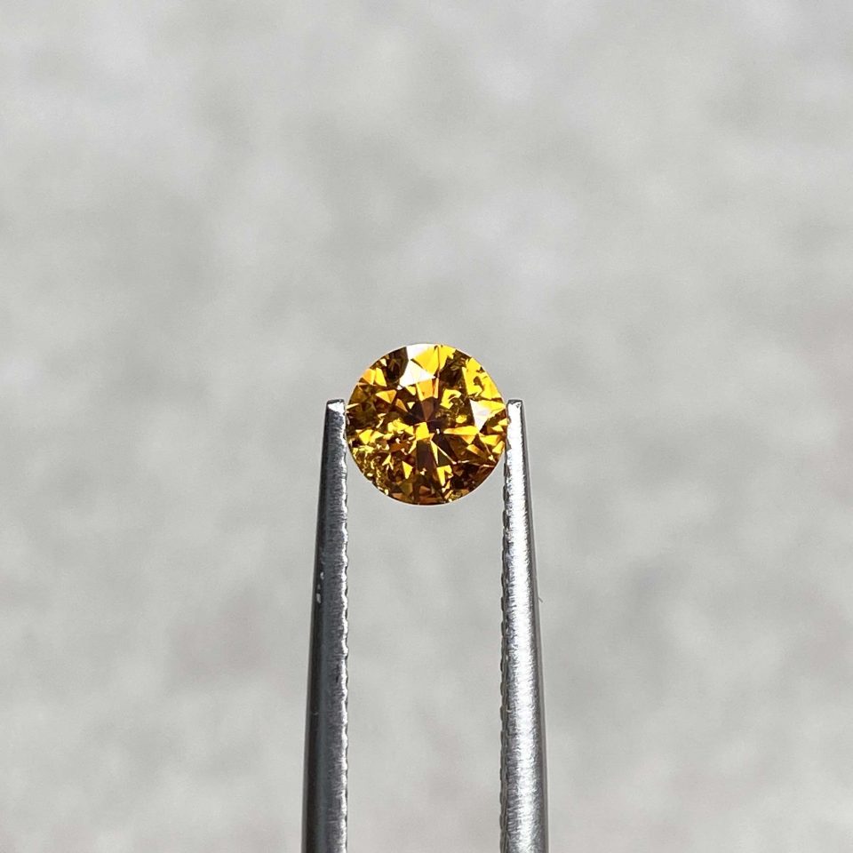 0.64 Ct Fancy Brownish Yellow/I1 Round Diamond